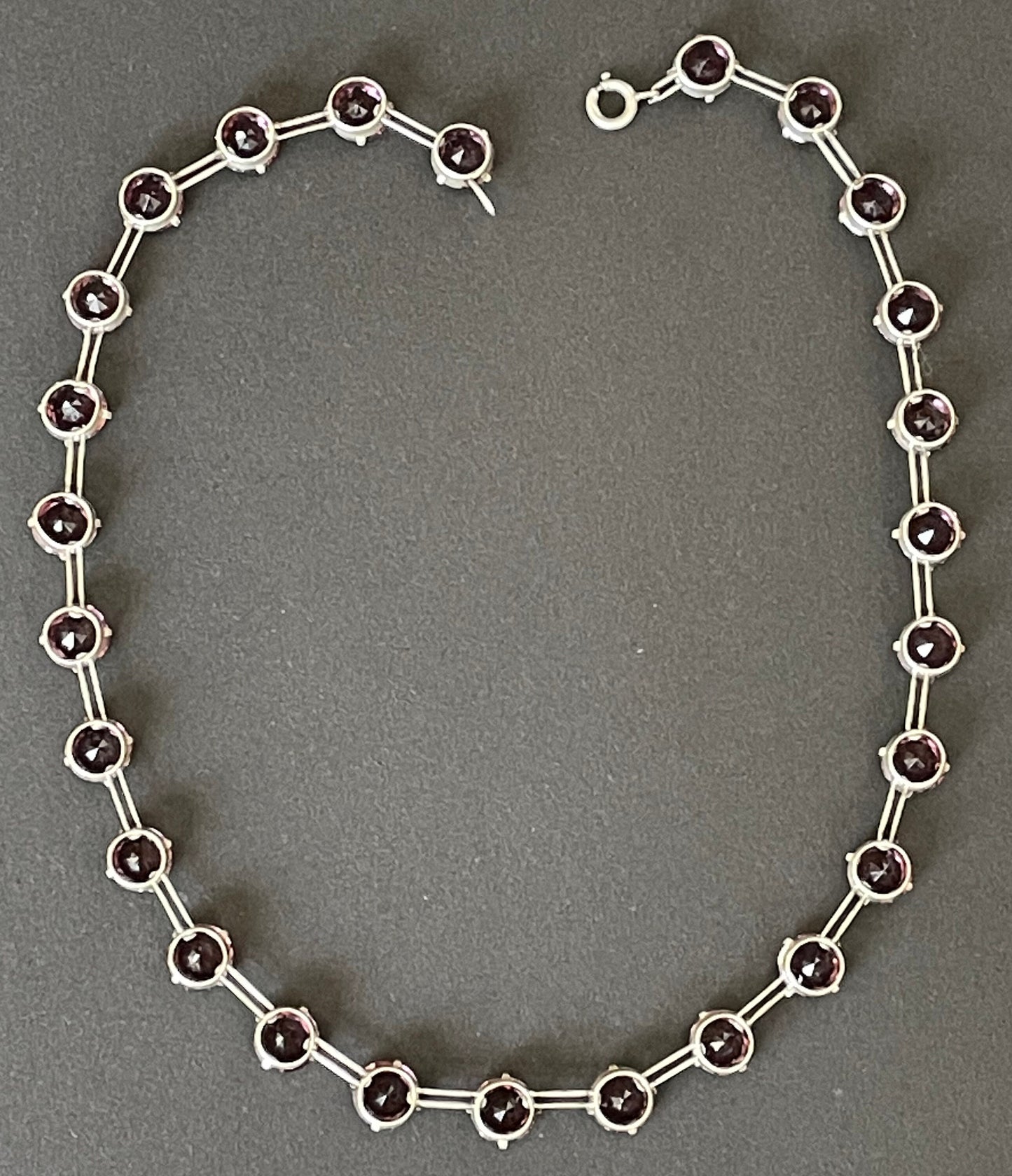 Vintage sterling silver Art Deco ruby pink / amethyst purple chaton cut crystal rhinestone riviere necklace bezel set, open backed, by W H Collins
