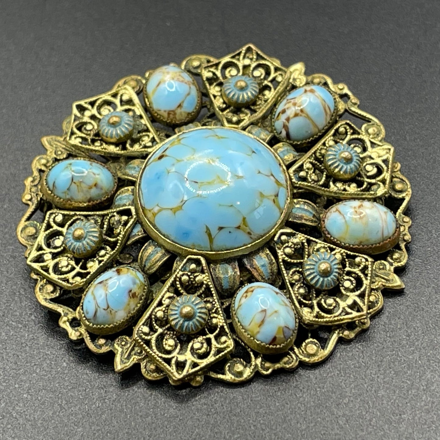 Vintage Neiger brothers Art Deco faux turquoise glass cabochon brooch in gold tone filigree