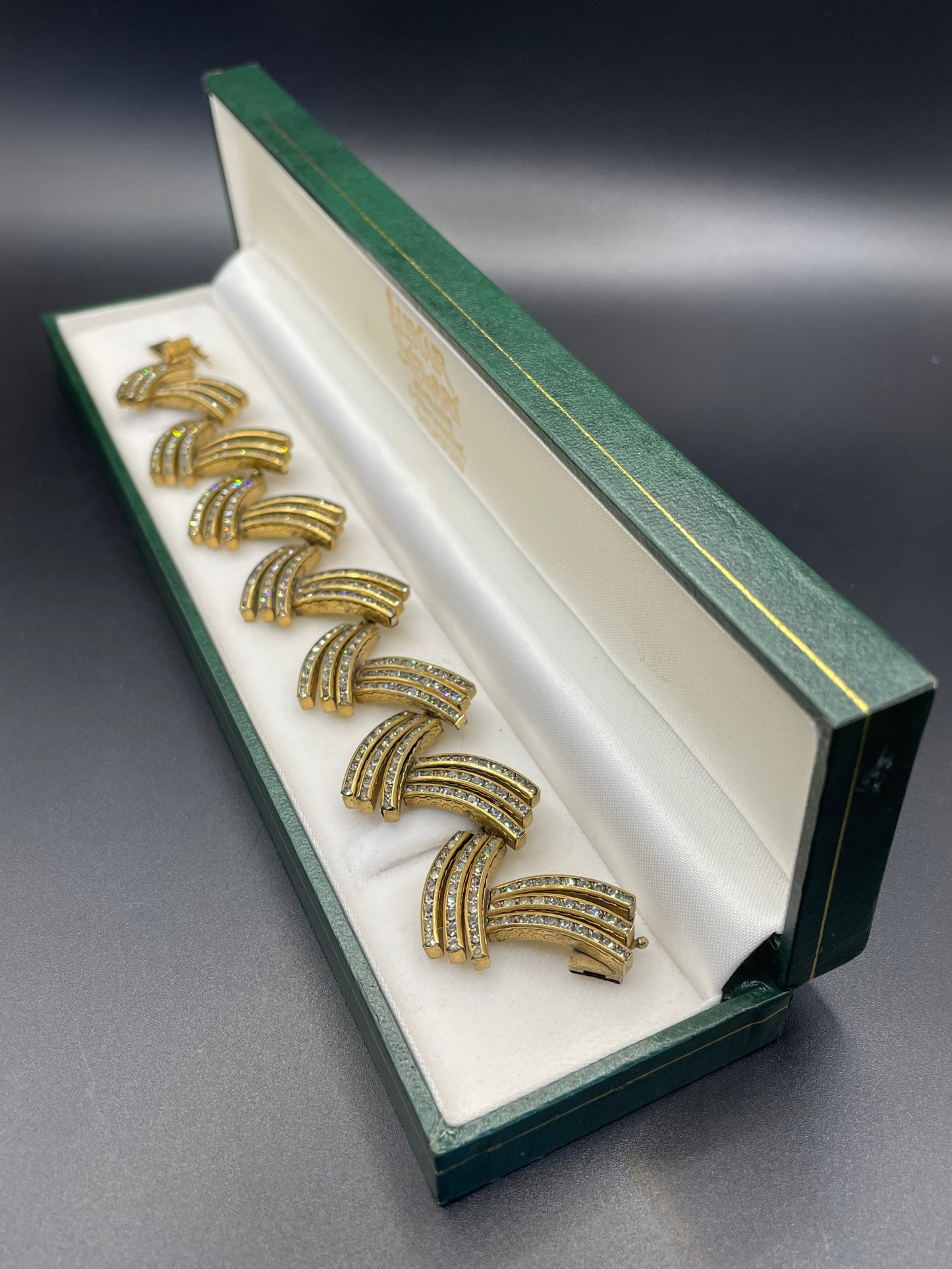 Vintage Schreiber and Hiller Art Deco channel set paste unusual spiky design cocktail bracelet, clear rhinestones and gold tone, boxed