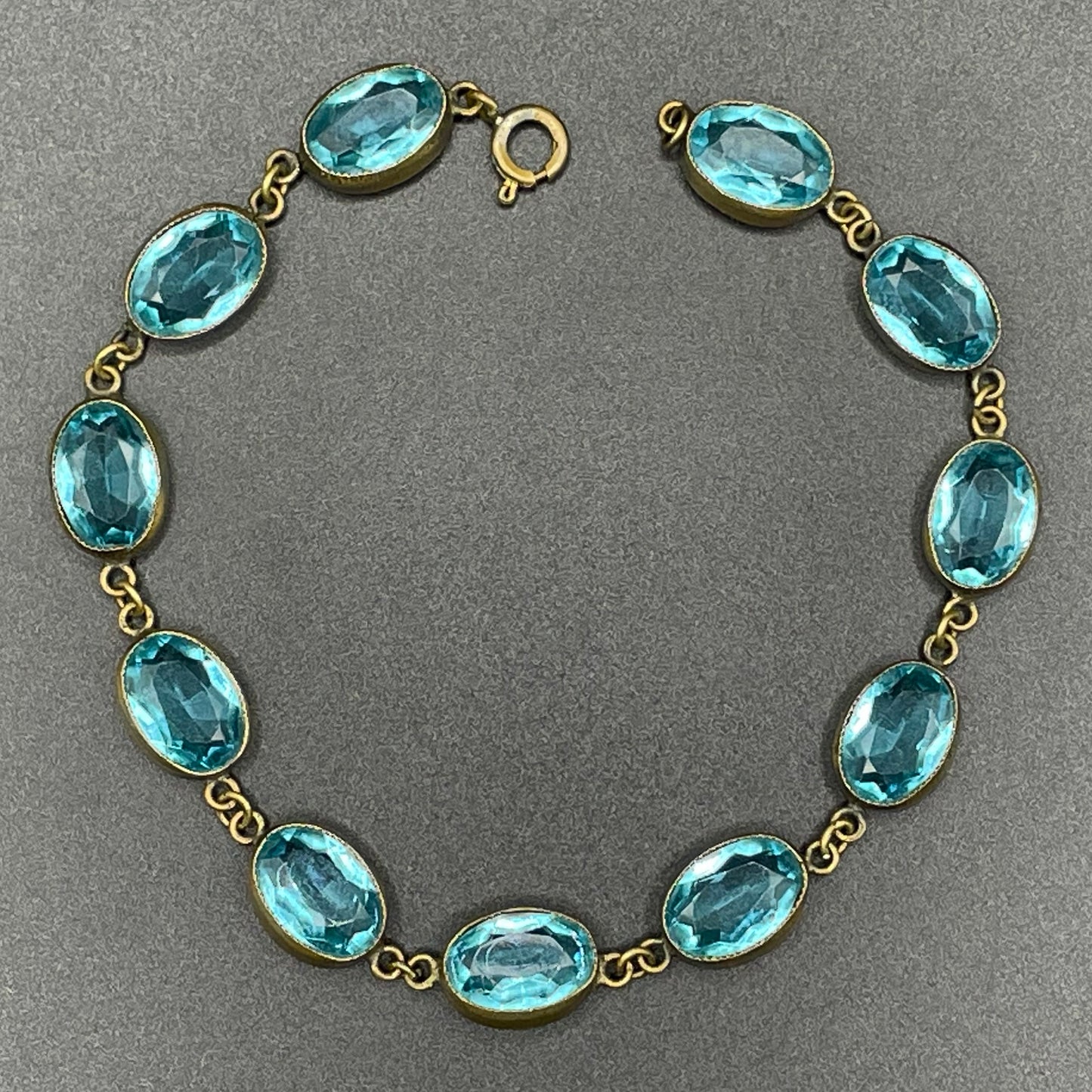 Vintage sapphire blue paste riviere collet set bracelet, bezel set, open backed large, oval glass stones, generous length