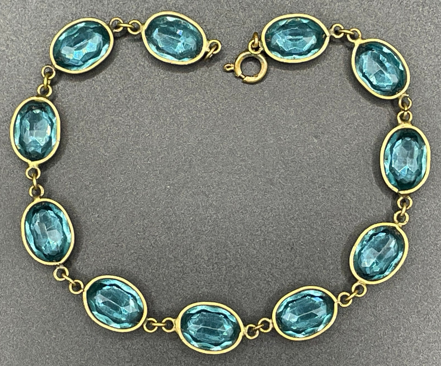 Vintage sapphire blue paste riviere collet set bracelet, bezel set, open backed large, oval glass stones, generous length