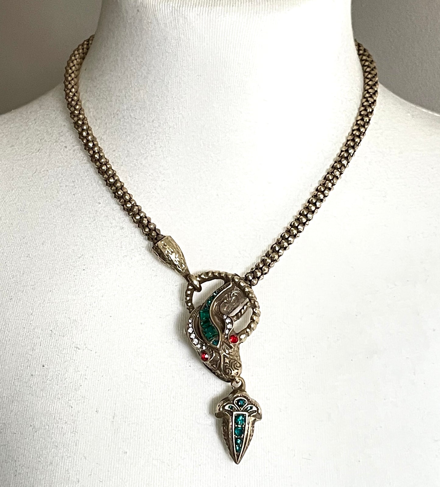 Vintage costume copy of opulent Victorian snake, serpent or dragon design lariat necklace, gold tone with red, green and clear rhinestones