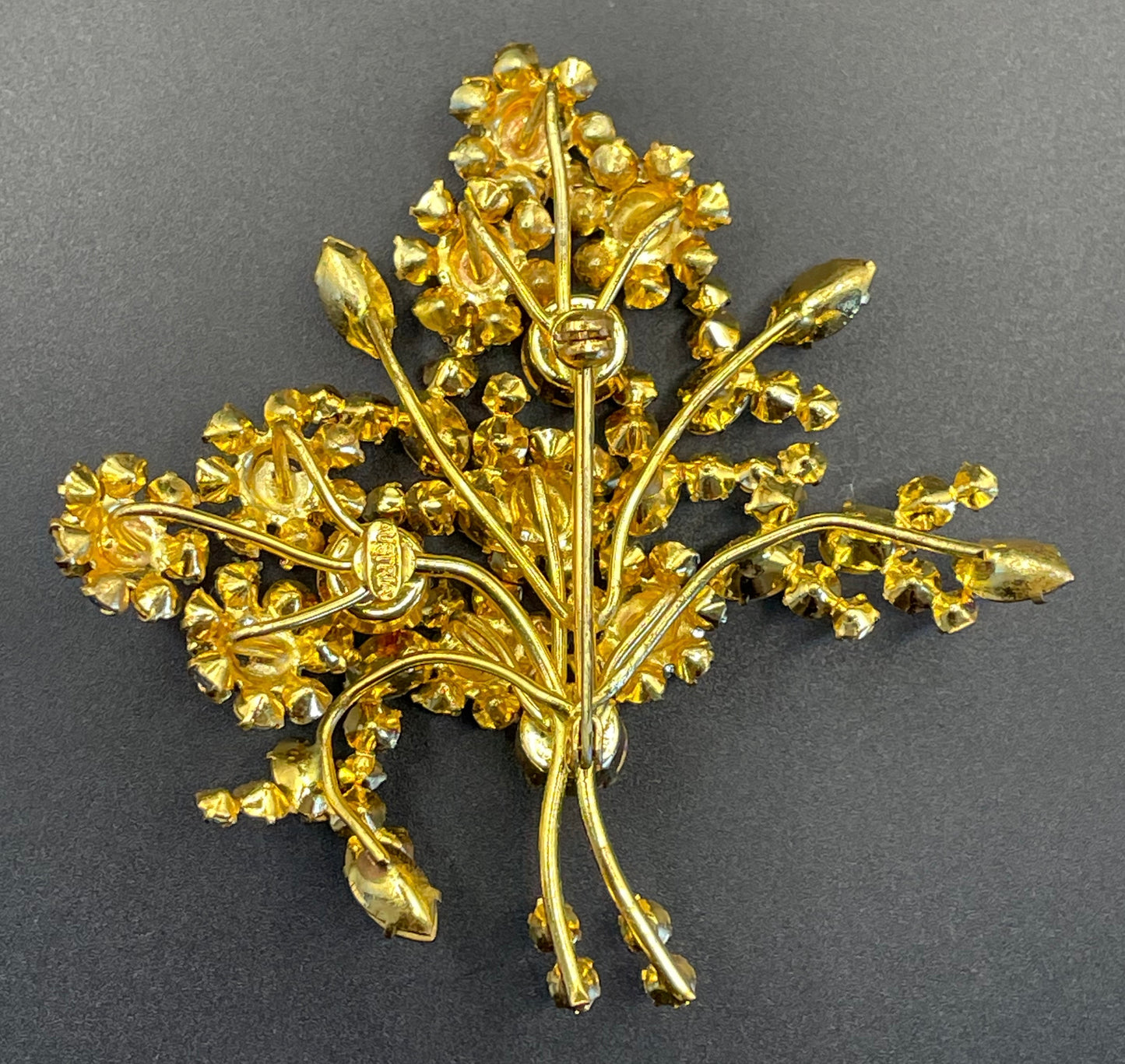 Large vintage Austrian crystal pink and blue rhinestone flower bouquet brooch in gold tone, signed 'Austria'