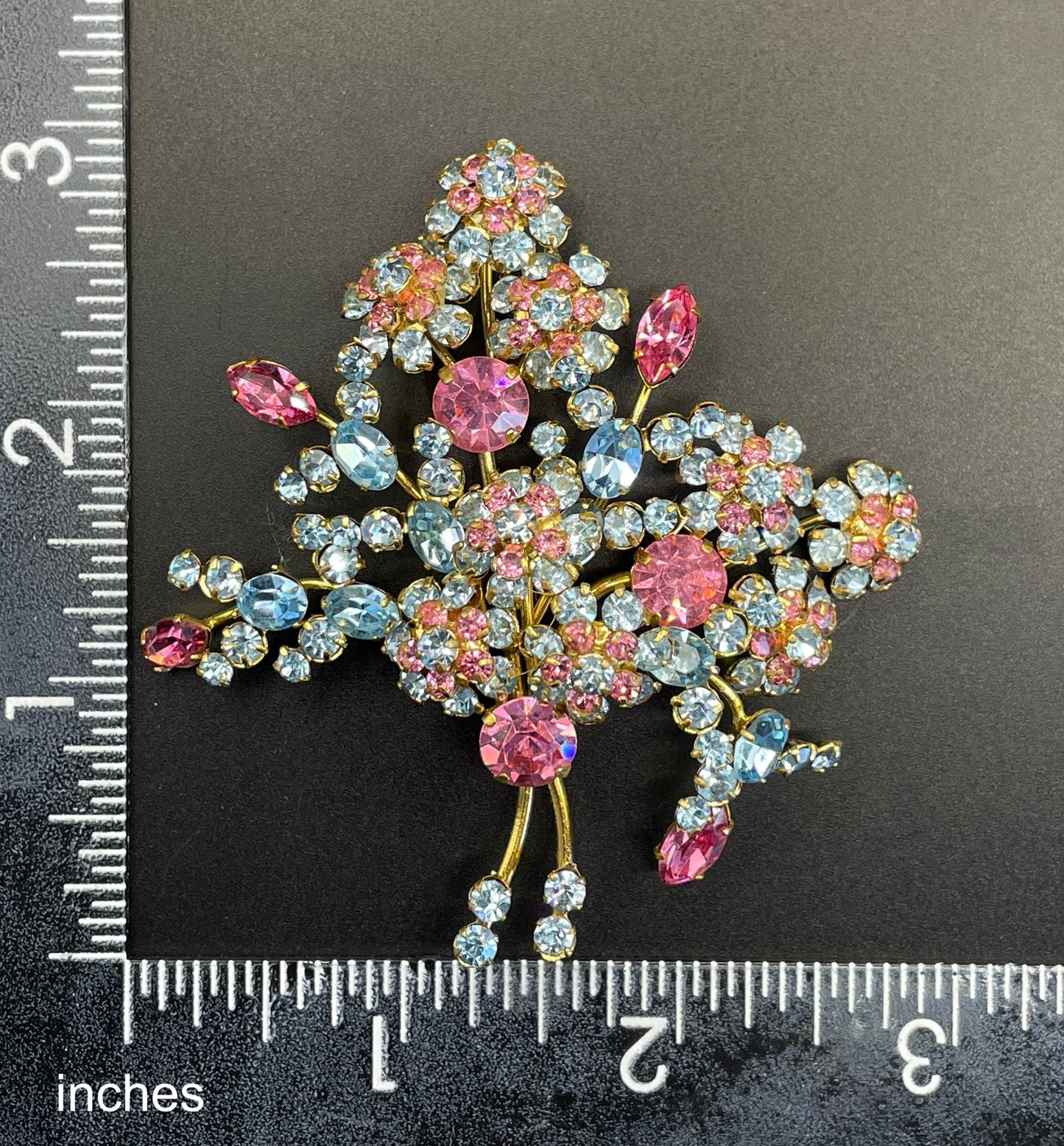 Large vintage Austrian crystal pink and blue rhinestone flower bouquet brooch in gold tone, signed 'Austria'