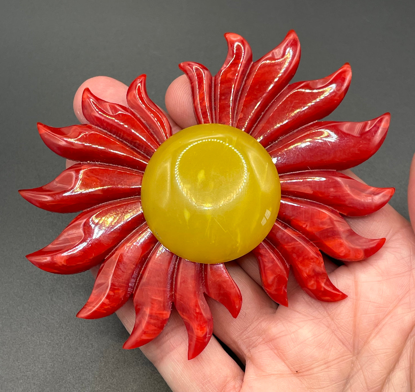 Vintage Art Deco galalith buckle with striking flame design and vibrant yellow, orange and red colours, can be worn as a statement pendant