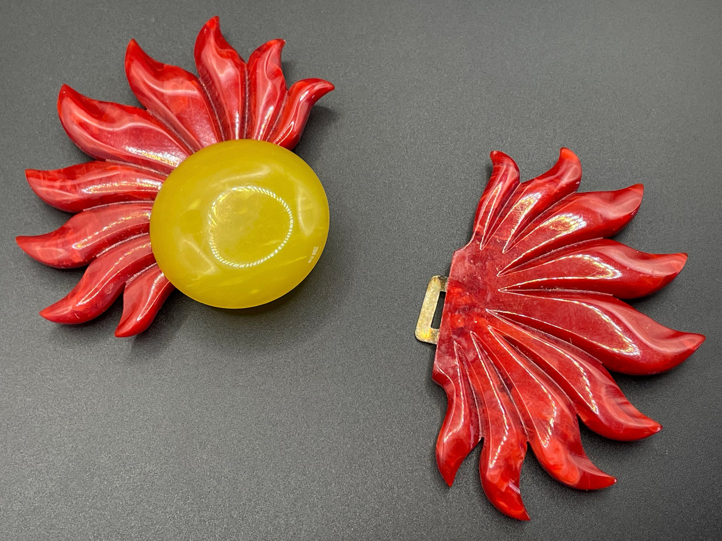 Vintage Art Deco galalith buckle with striking flame design and vibrant yellow, orange and red colours, can be worn as a statement pendant