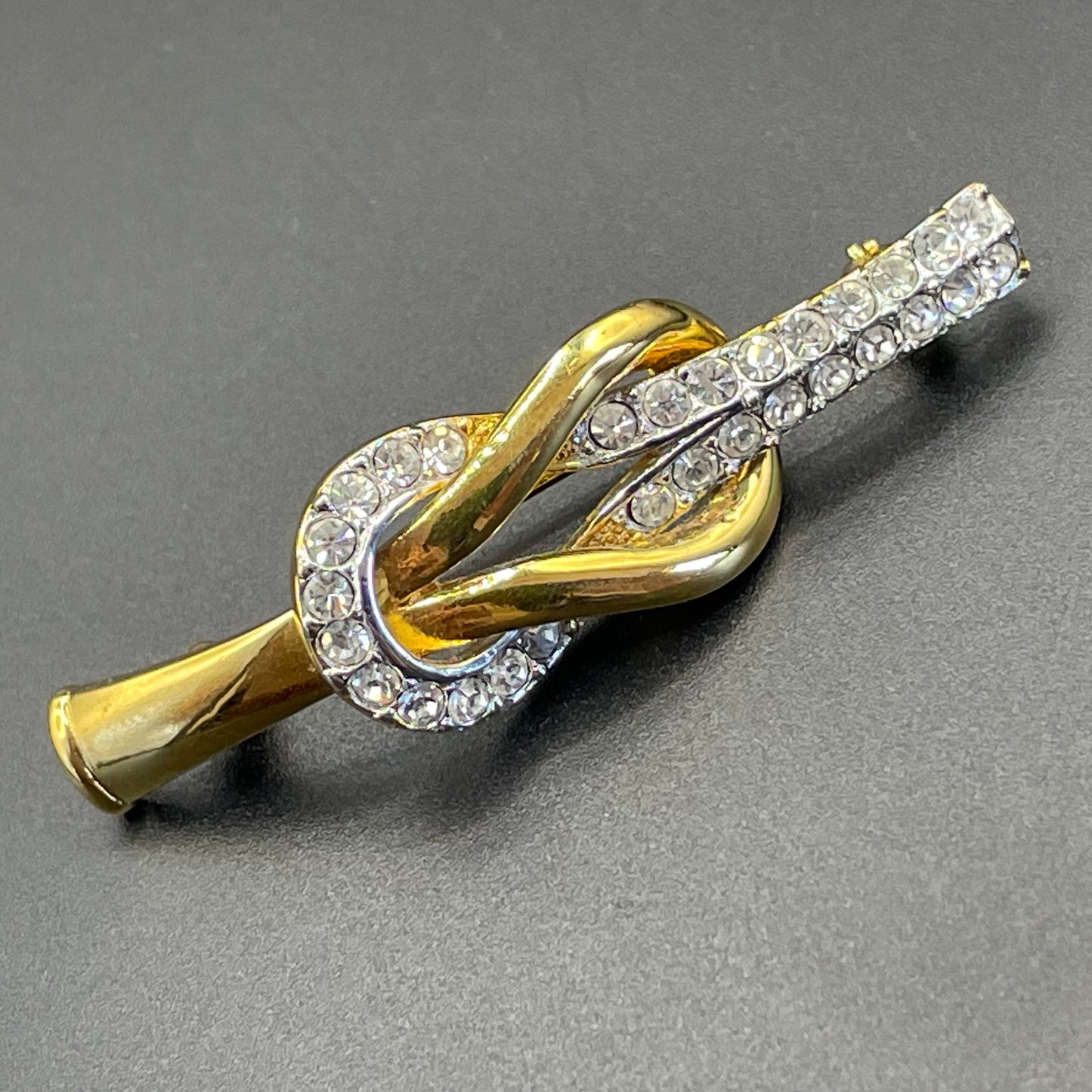 Vintage Attwood and Sawyer (A&S) 22ct gold plated clear rhinestone lovers' knot brooch