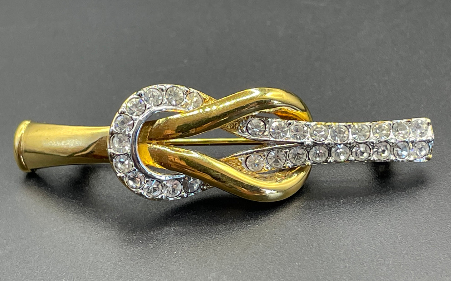 Vintage Attwood and Sawyer (A&S) 22ct gold plated clear rhinestone lovers' knot brooch