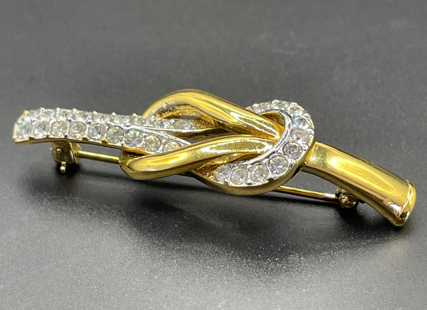 Vintage Attwood and Sawyer (A&S) 22ct gold plated clear rhinestone lovers' knot brooch