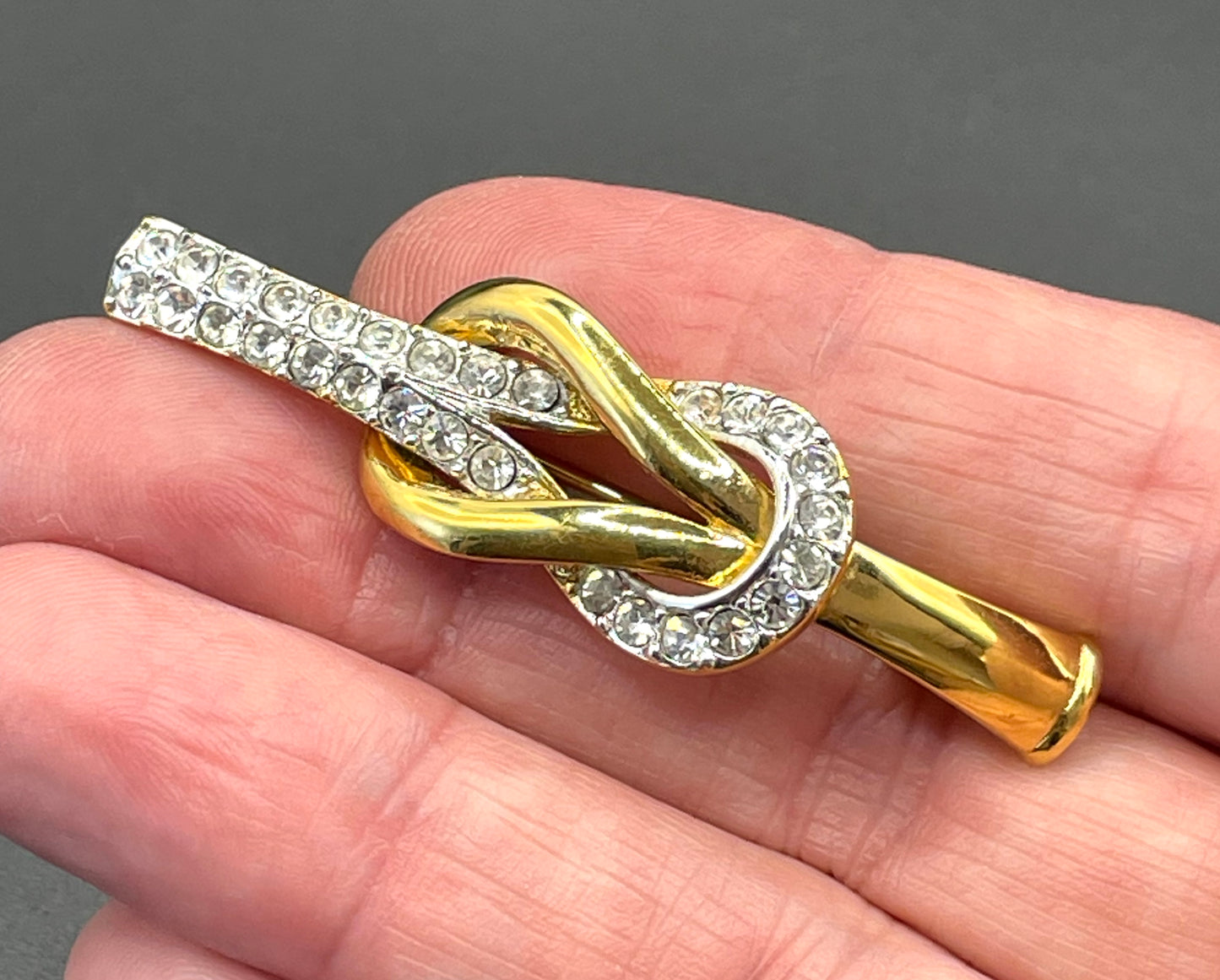 Vintage Attwood and Sawyer (A&S) 22ct gold plated clear rhinestone lovers' knot brooch