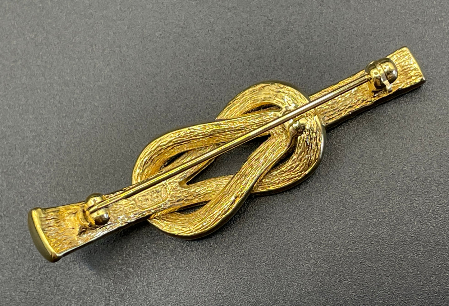 Vintage Attwood and Sawyer (A&S) 22ct gold plated clear rhinestone lovers' knot brooch