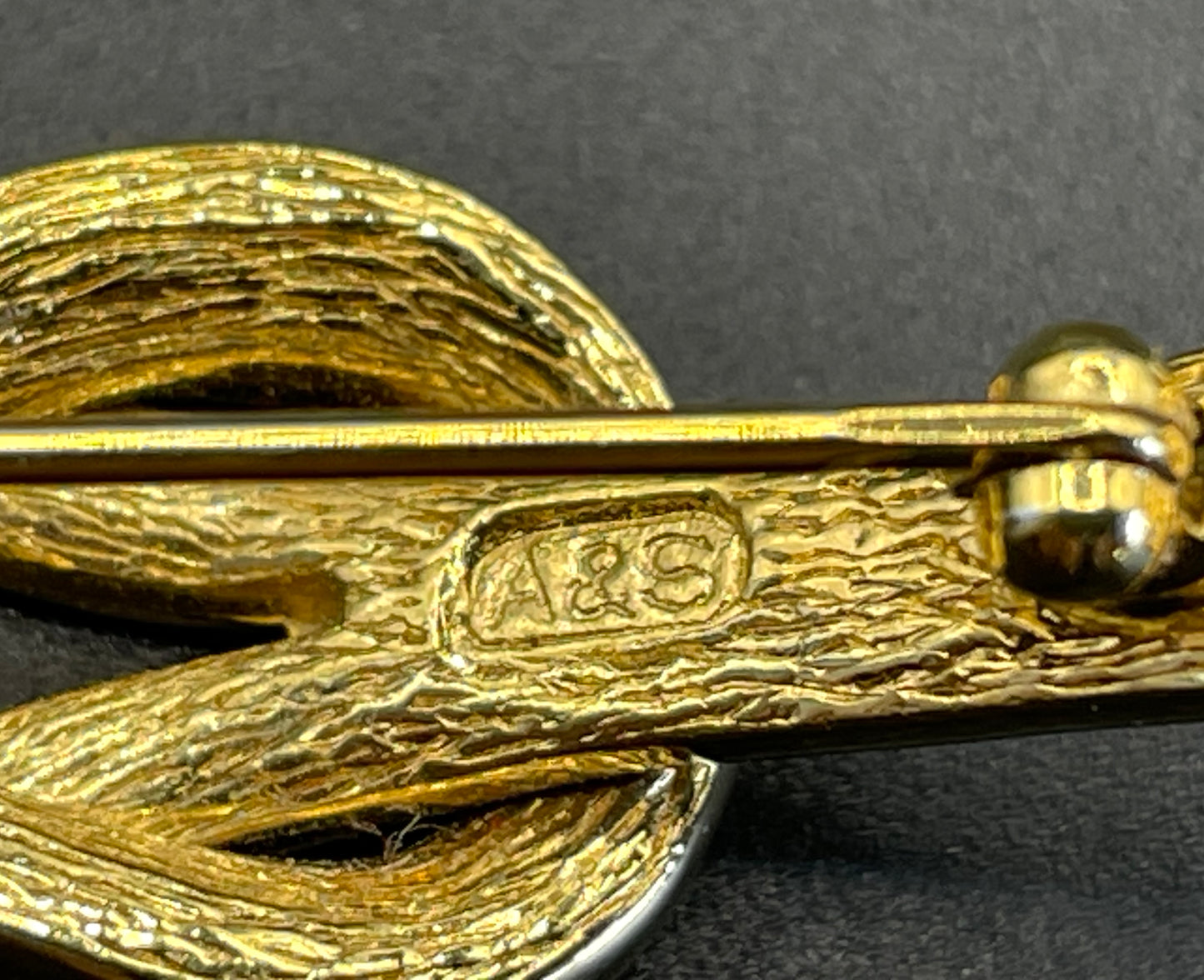 Vintage Attwood and Sawyer (A&S) 22ct gold plated clear rhinestone lovers' knot brooch