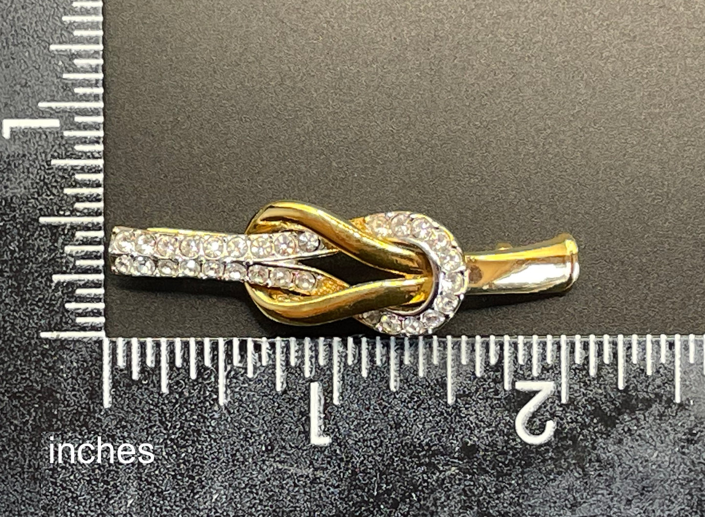 Vintage Attwood and Sawyer (A&S) 22ct gold plated clear rhinestone lovers' knot brooch