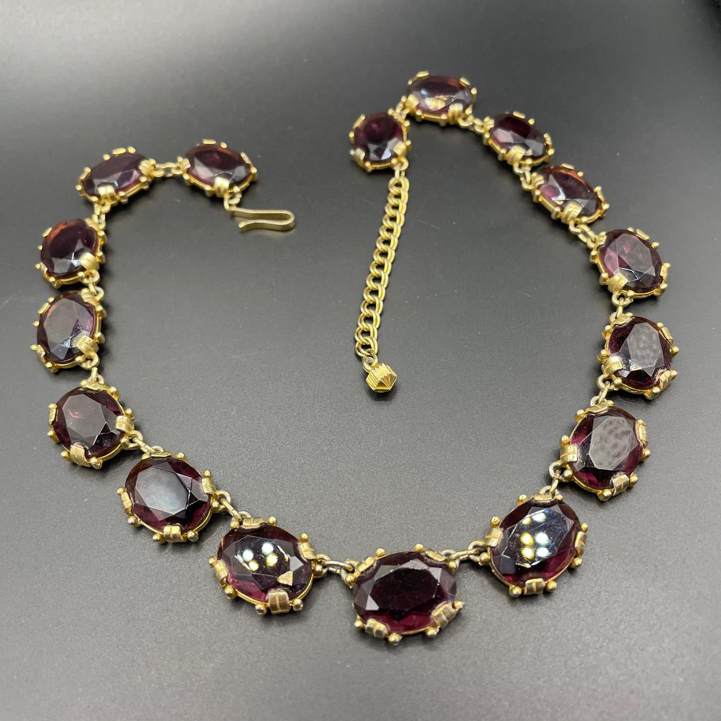Vintage Sphinx amethyst purple glass riviere necklace, heavy, bezel set, open-backed stones in ornate gold tone settings