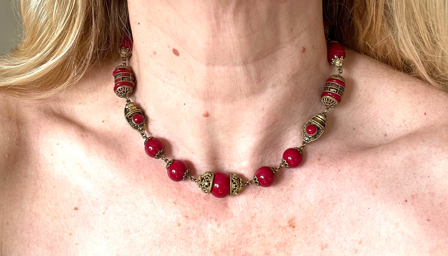 Vintage Neiger Brothers Art Deco heavy red glass bead necklace with beautiful gold tone features - by Max Neiger