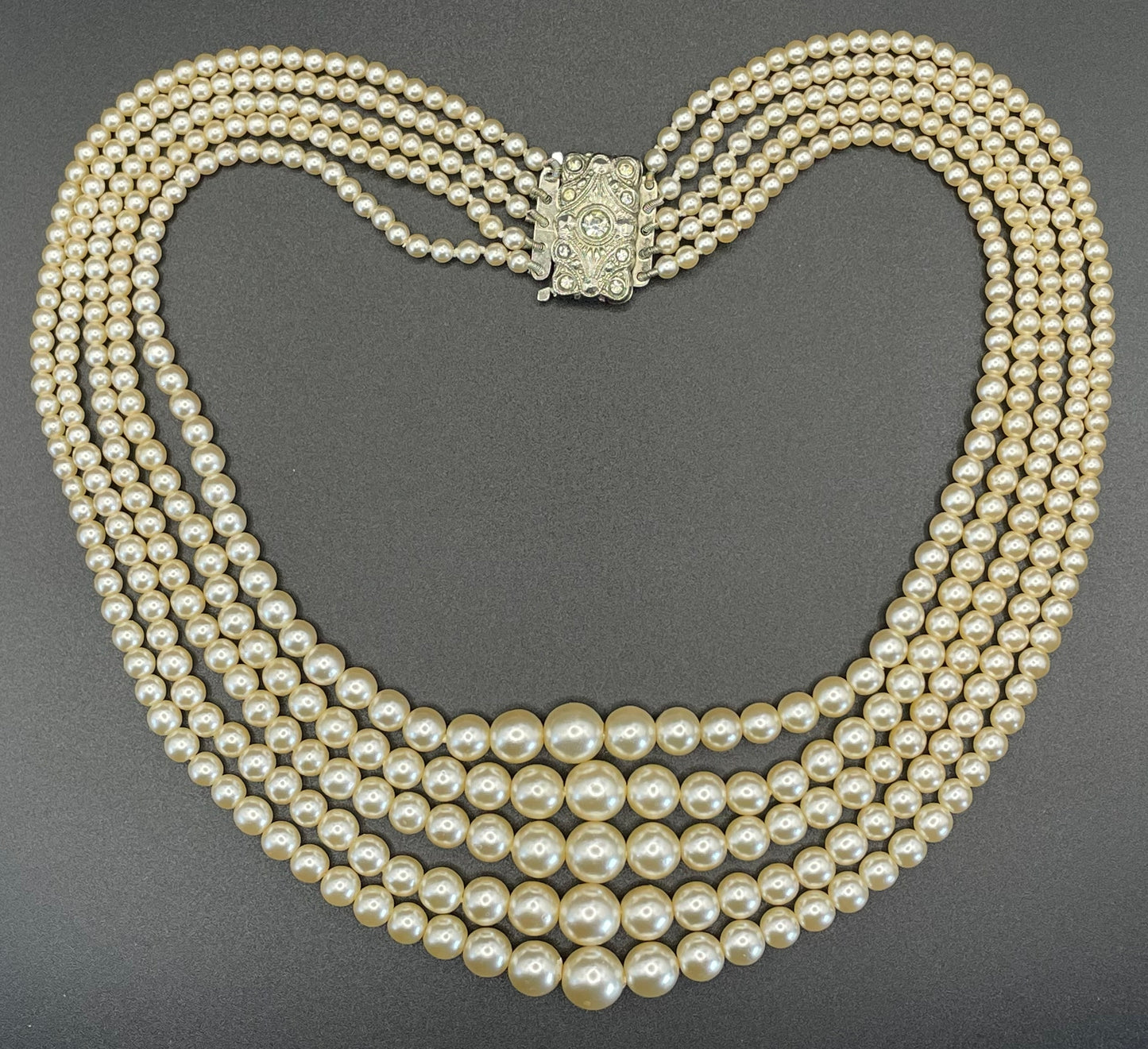 Vintage five strand glass faux pearl necklace with ornate clear rhinestone box clasp, graduated glass pearls