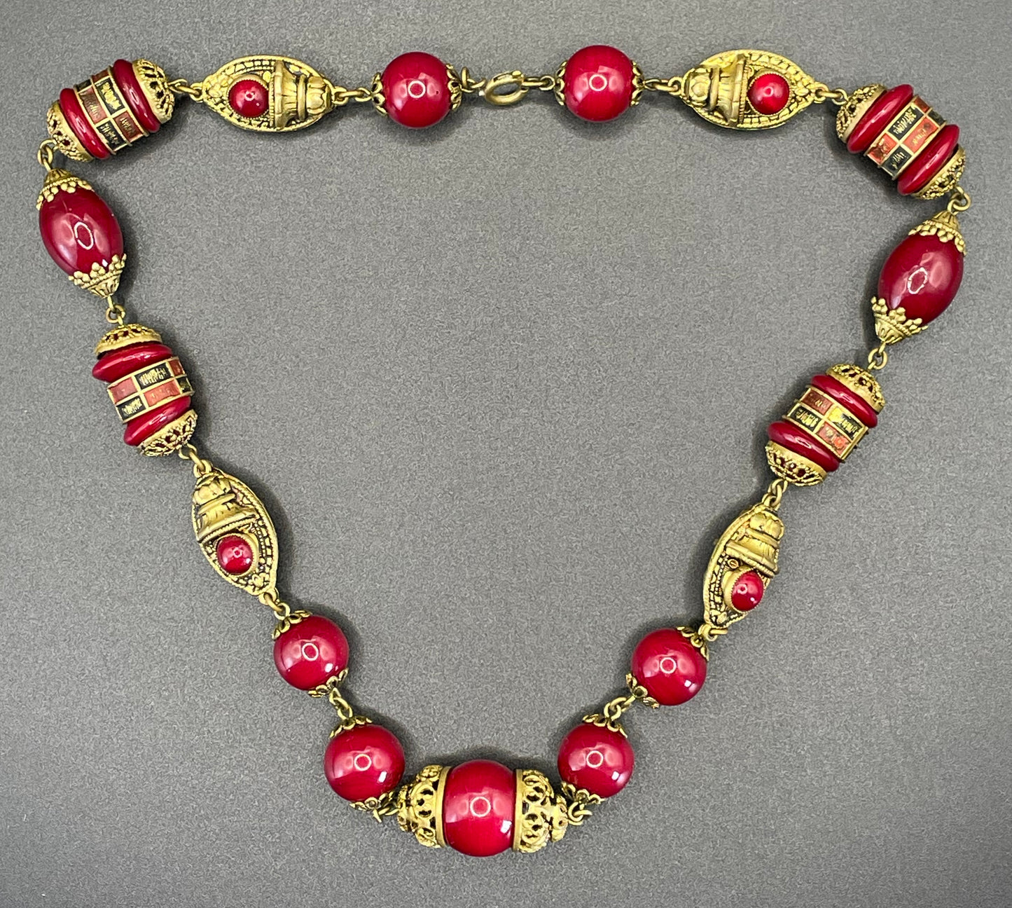 Vintage Neiger Brothers Art Deco heavy red glass bead necklace with beautiful gold tone features - by Max Neiger