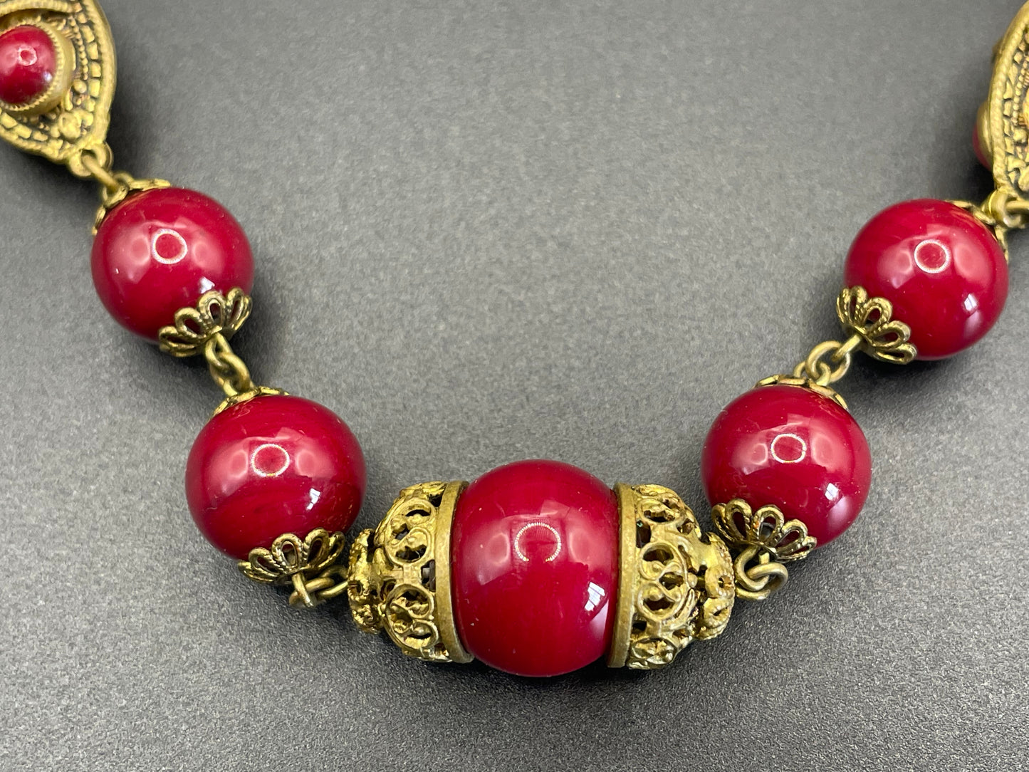 Vintage Neiger Brothers Art Deco heavy red glass bead necklace with beautiful gold tone features - by Max Neiger