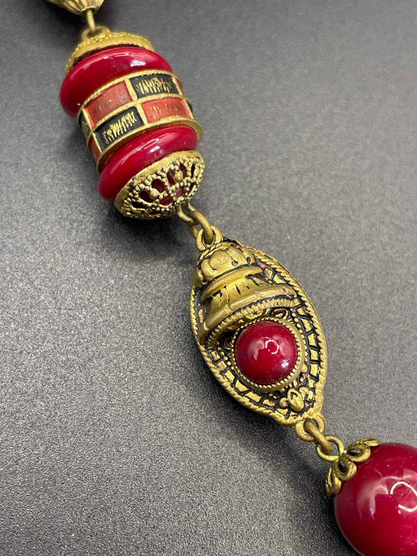 Vintage Neiger Brothers Art Deco heavy red glass bead necklace with beautiful gold tone features - by Max Neiger