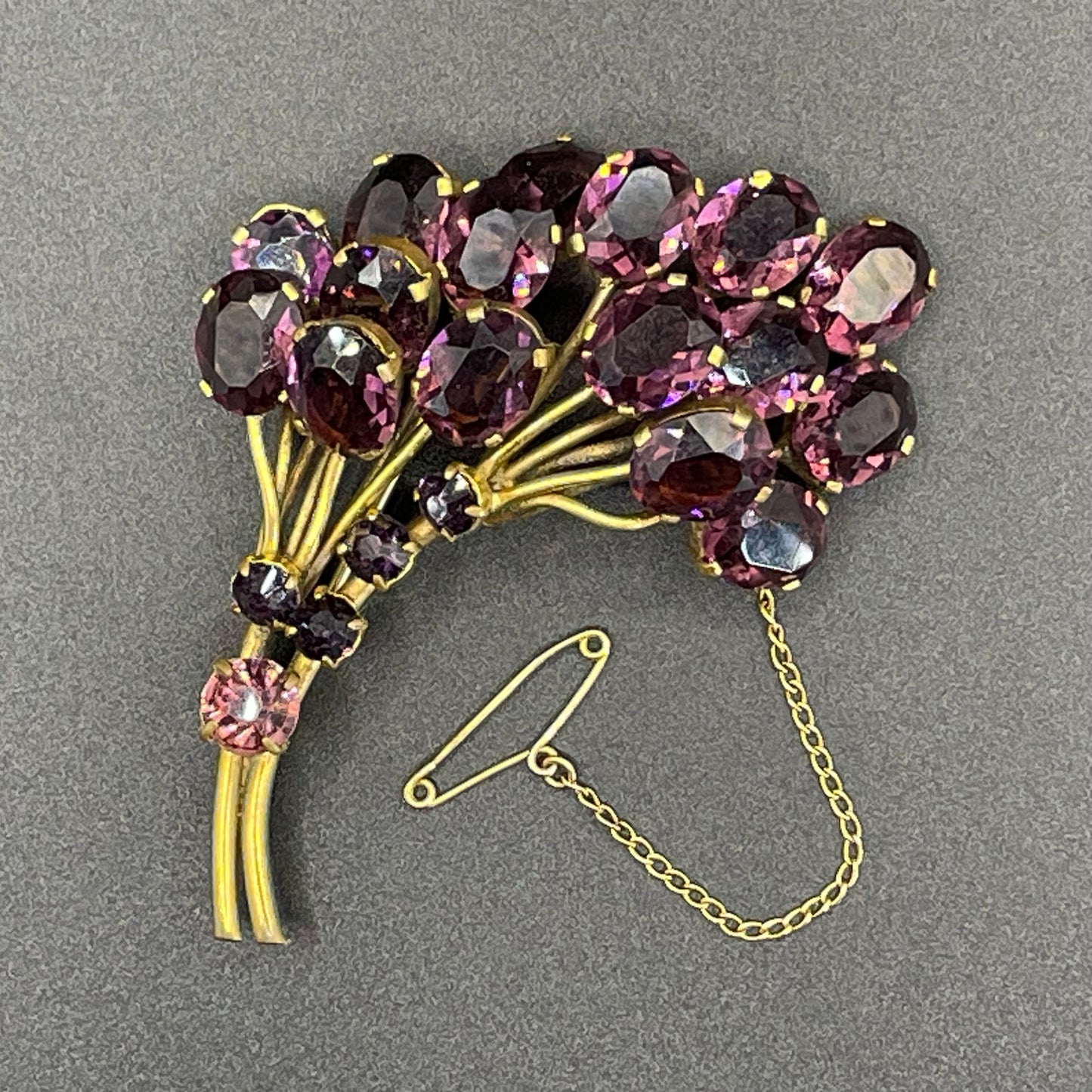 Large vintage Art Deco gorgeous vibrant amethyst purple crystal Czech flower bouquet brooch, open-backed rhinestones in gold tone