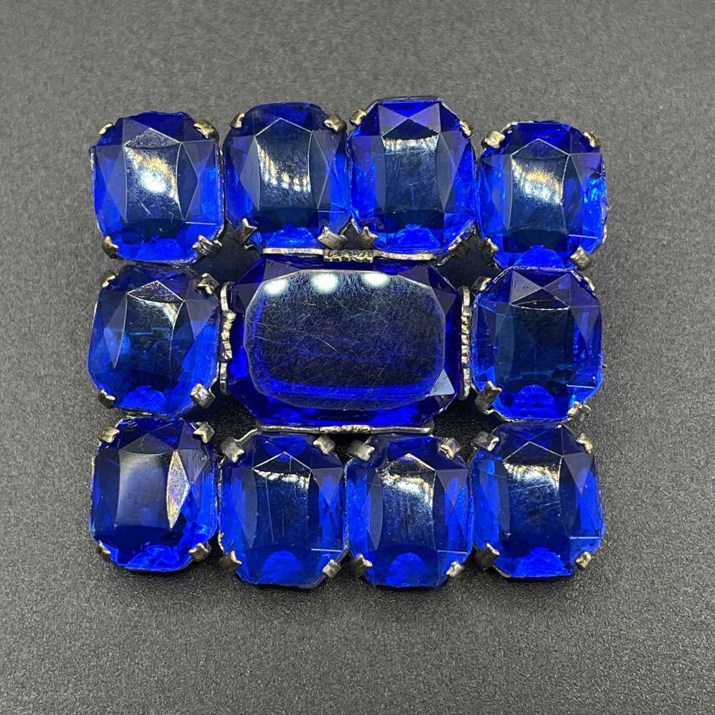 Vintage Art Deco vibrant sapphire blue crystal brooch, open-backed baguette cut rectangular glass rhinestones