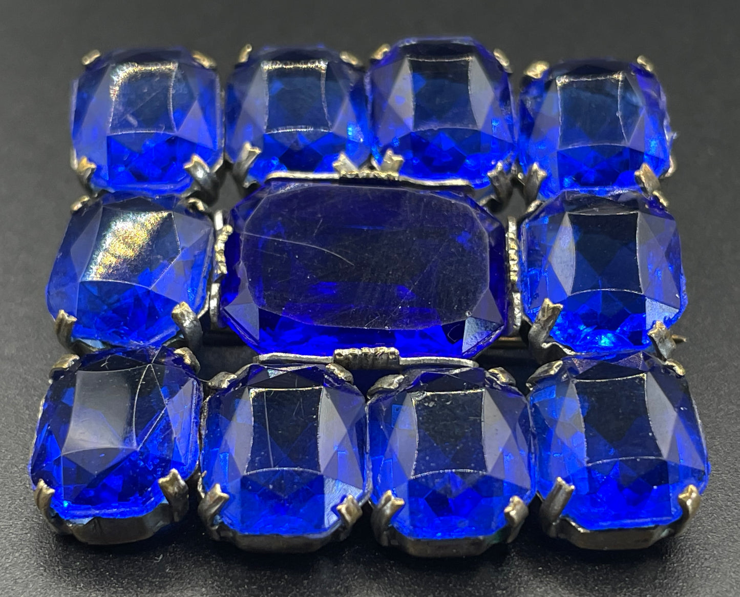 Vintage Art Deco vibrant sapphire blue crystal brooch, open-backed baguette cut rectangular glass rhinestones