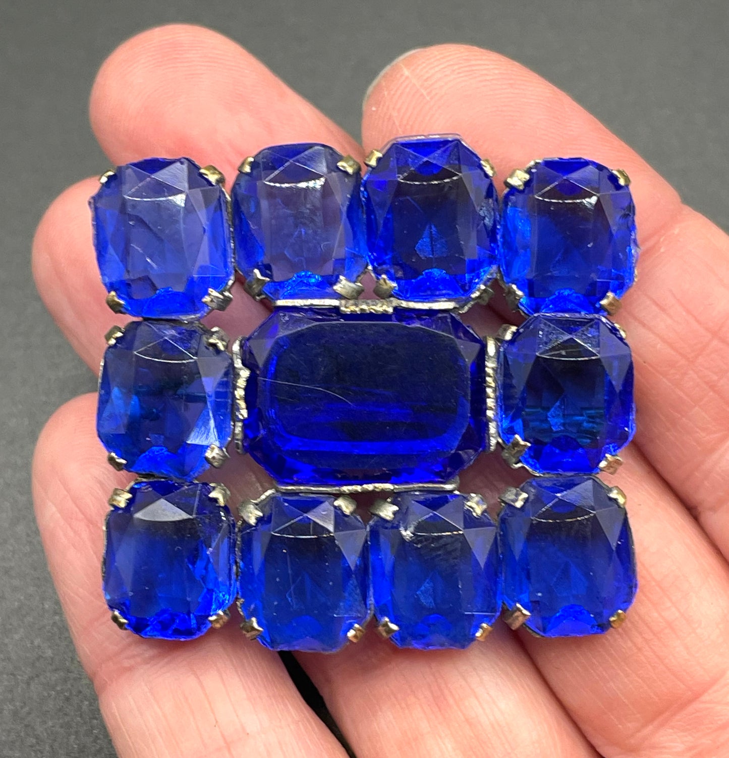 Vintage Art Deco vibrant sapphire blue crystal brooch, open-backed baguette cut rectangular glass rhinestones