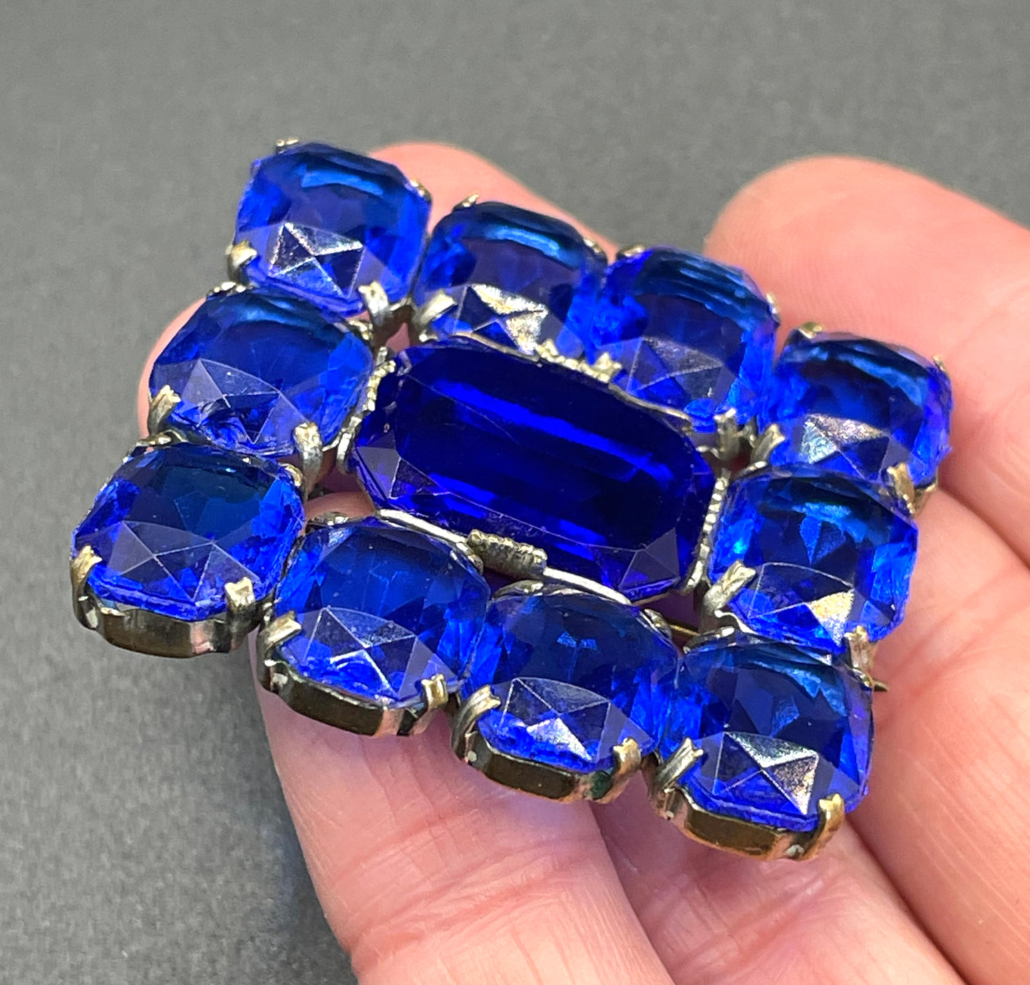 Vintage Art Deco vibrant sapphire blue crystal brooch, open-backed baguette cut rectangular glass rhinestones