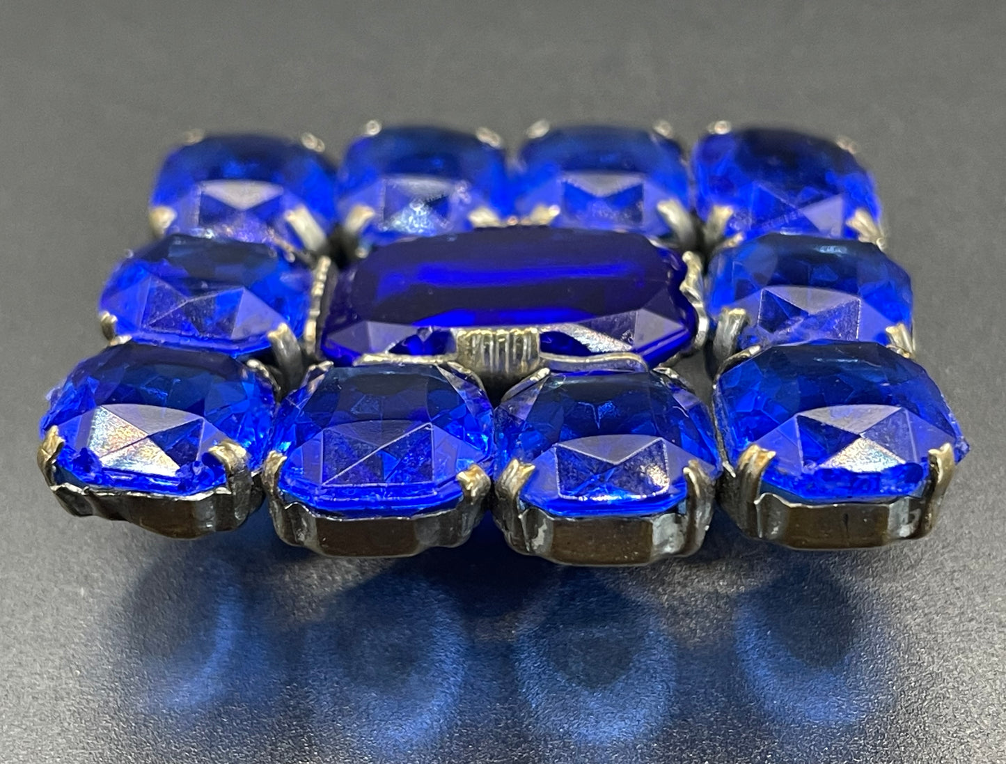 Vintage Art Deco vibrant sapphire blue crystal brooch, open-backed baguette cut rectangular glass rhinestones