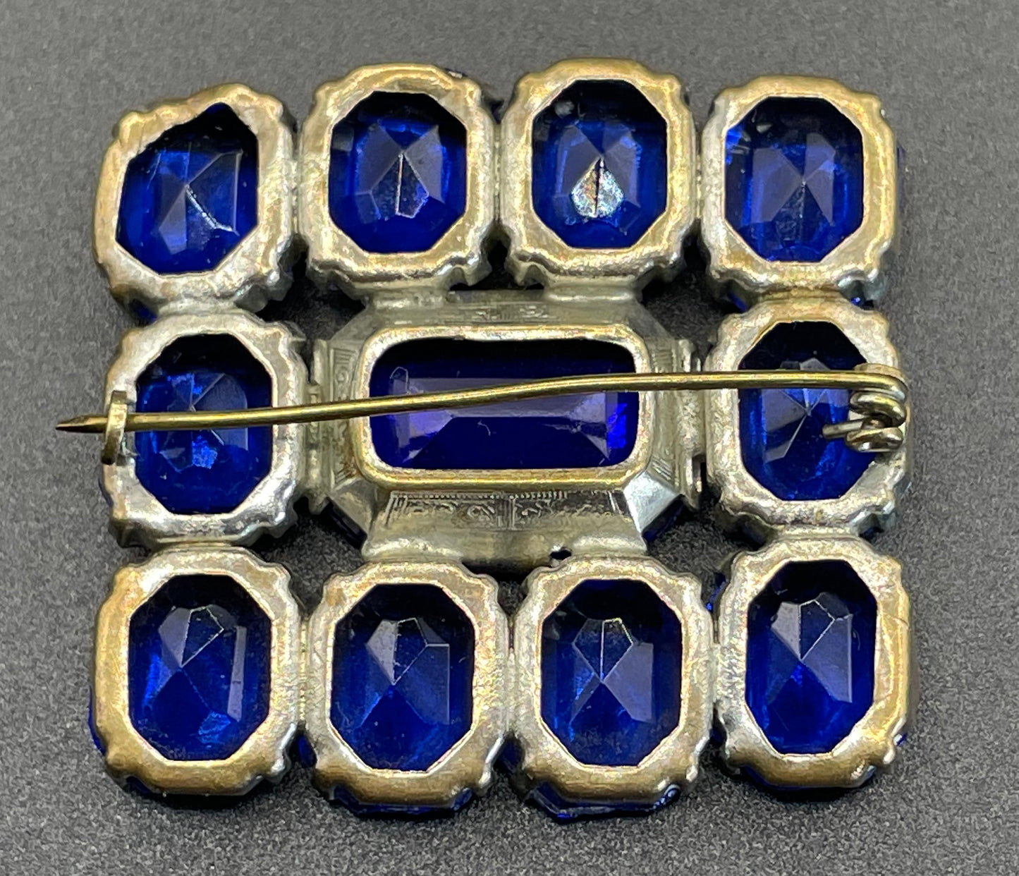 Vintage Art Deco vibrant sapphire blue crystal brooch, open-backed baguette cut rectangular glass rhinestones