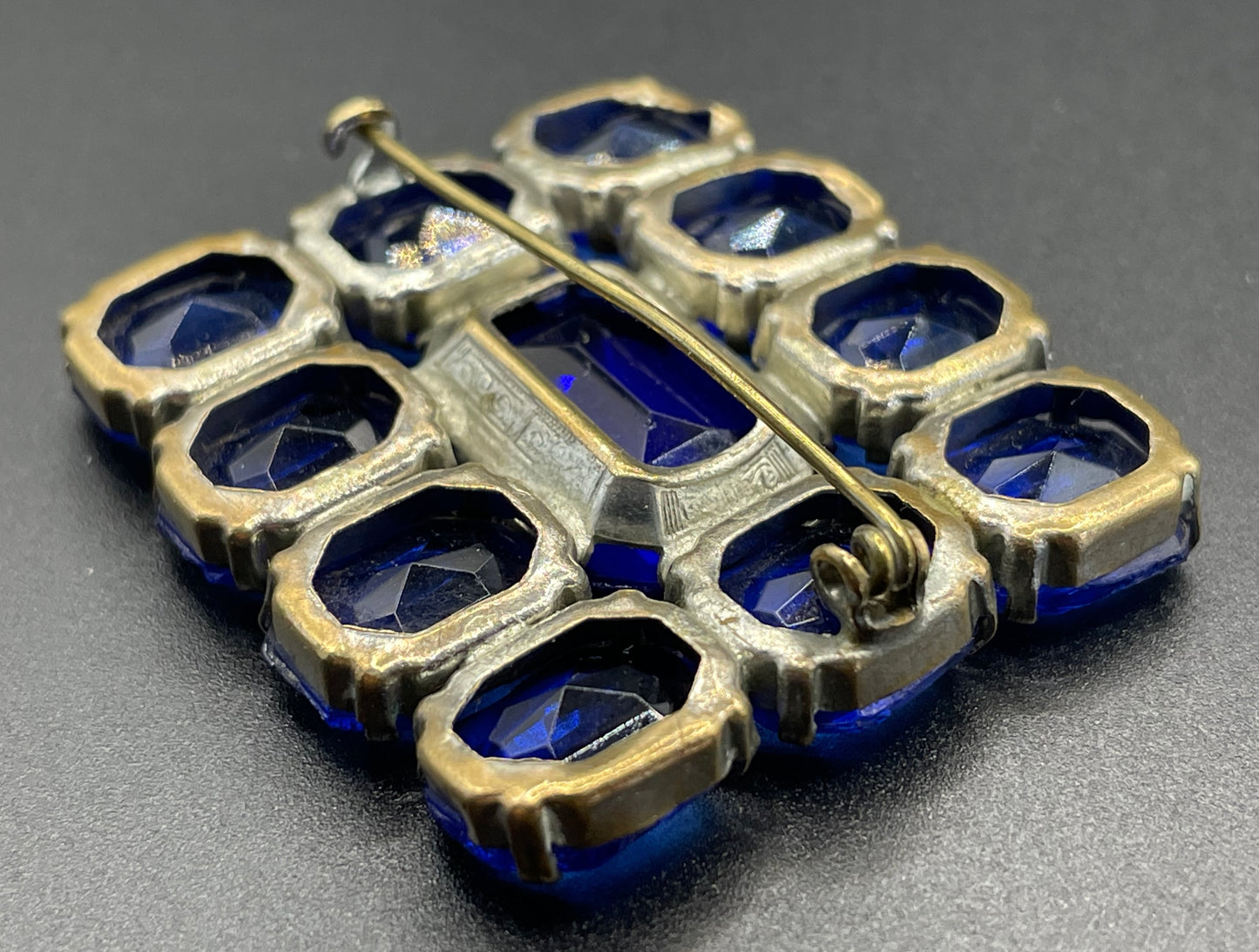 Vintage Art Deco vibrant sapphire blue crystal brooch, open-backed baguette cut rectangular glass rhinestones