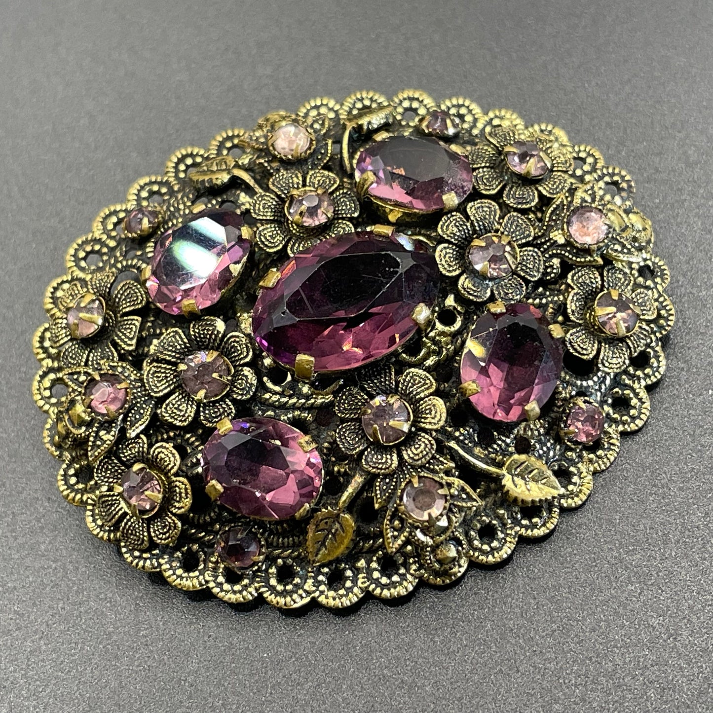 Large vintage Neiger style Art Deco amethyst purple glass rhinestone Czech brooch in antique gold tone filigree, floral design