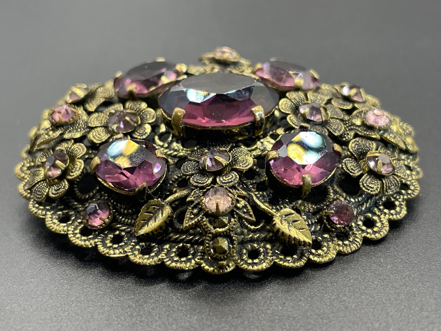 Large vintage Neiger style Art Deco amethyst purple glass rhinestone Czech brooch in antique gold tone filigree, floral design