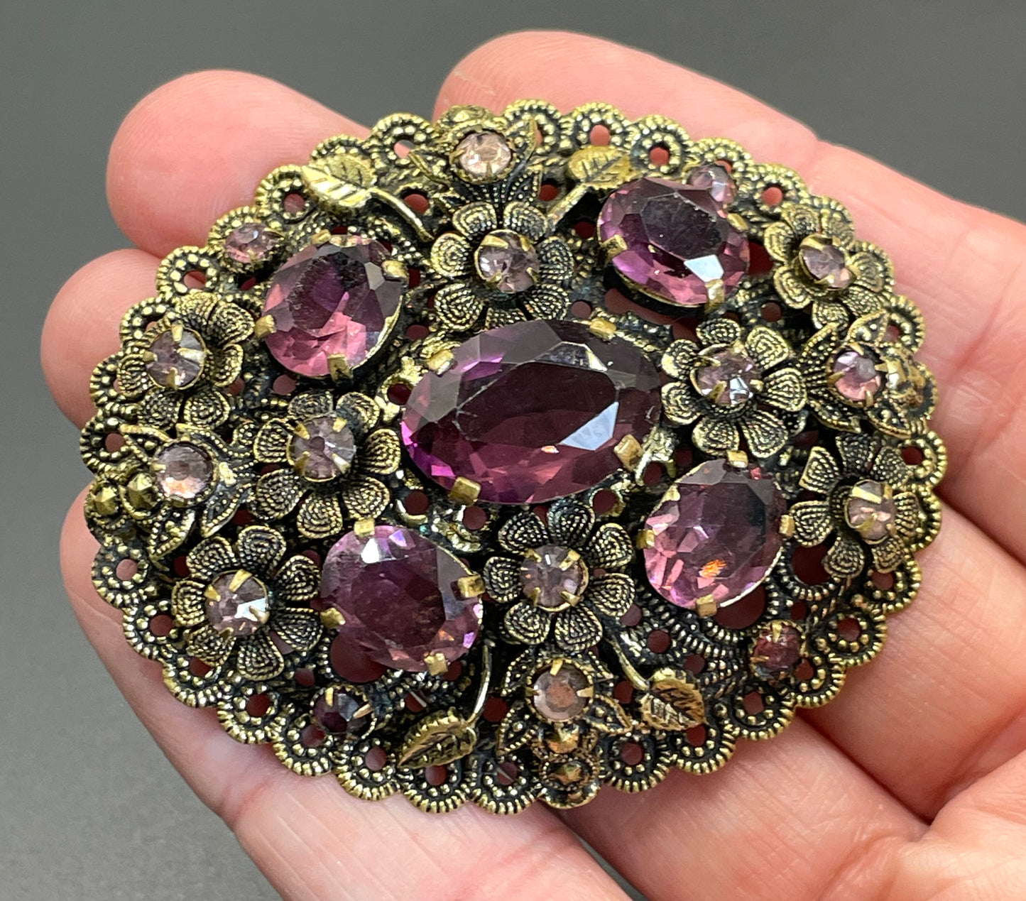 Large vintage Neiger style Art Deco amethyst purple glass rhinestone Czech brooch in antique gold tone filigree, floral design