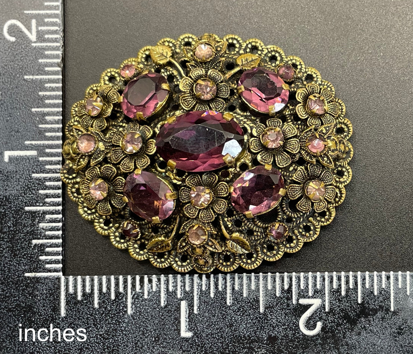 Large vintage Neiger style Art Deco amethyst purple glass rhinestone Czech brooch in antique gold tone filigree, floral design
