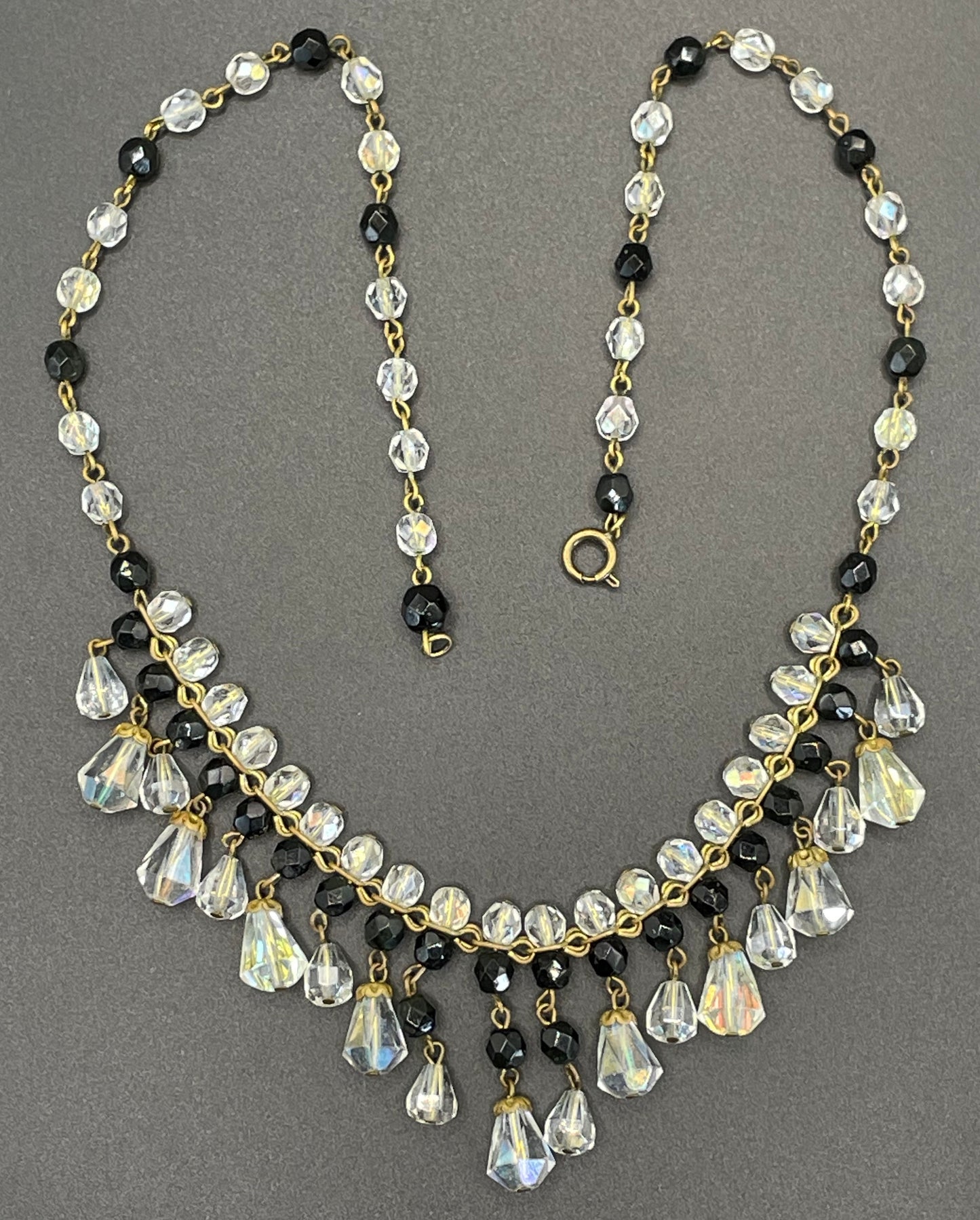 Vintage black and clear aurora borealis crystal faceted cut glass beaded fringe necklace with gold tone, delicate monochrome design