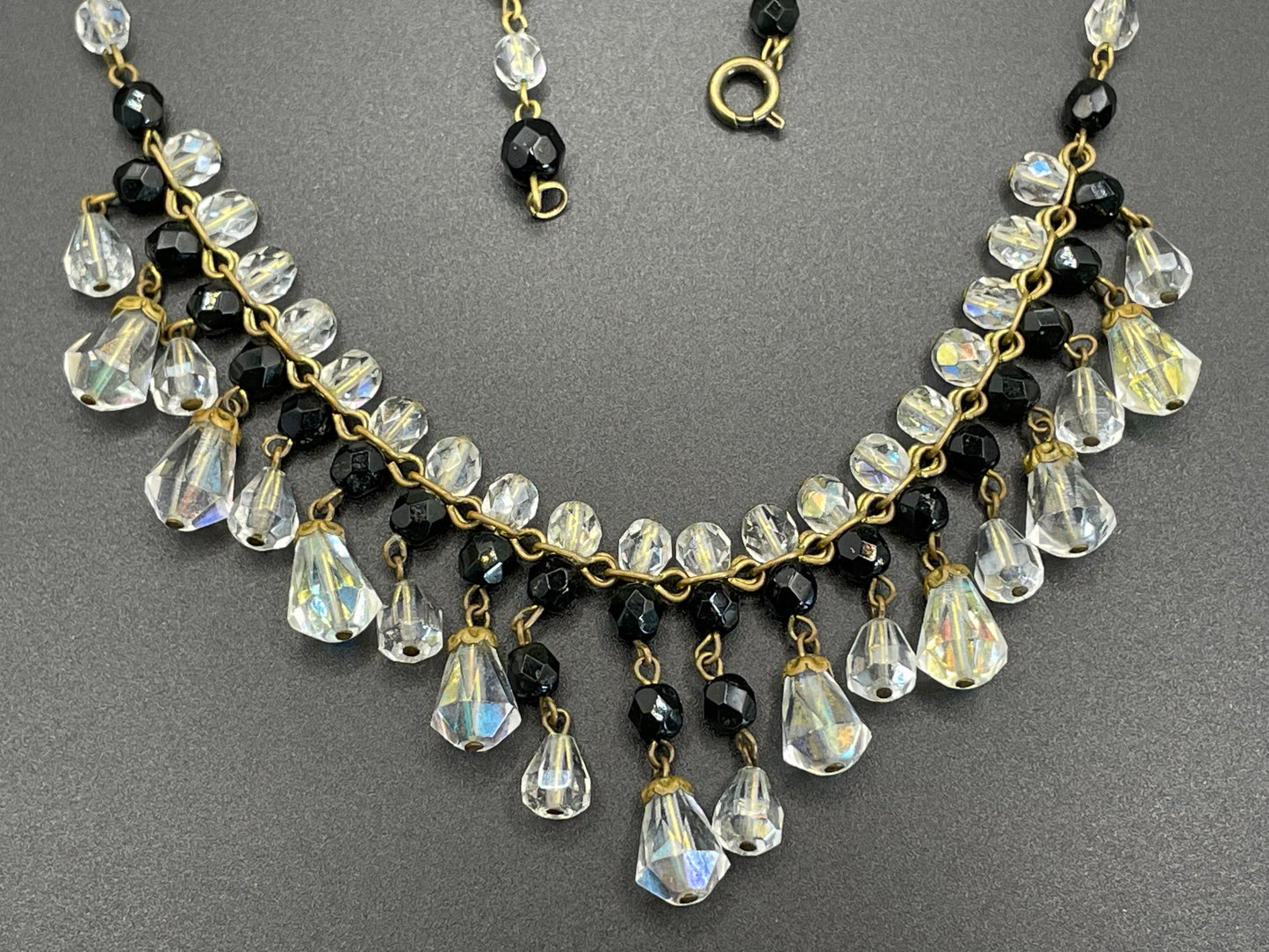 Vintage black and clear aurora borealis crystal faceted cut glass beaded fringe necklace with gold tone, delicate monochrome design