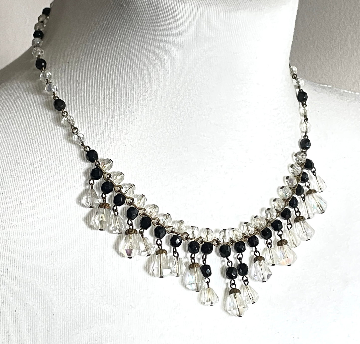 Vintage black and clear aurora borealis crystal faceted cut glass beaded fringe necklace with gold tone, delicate monochrome design