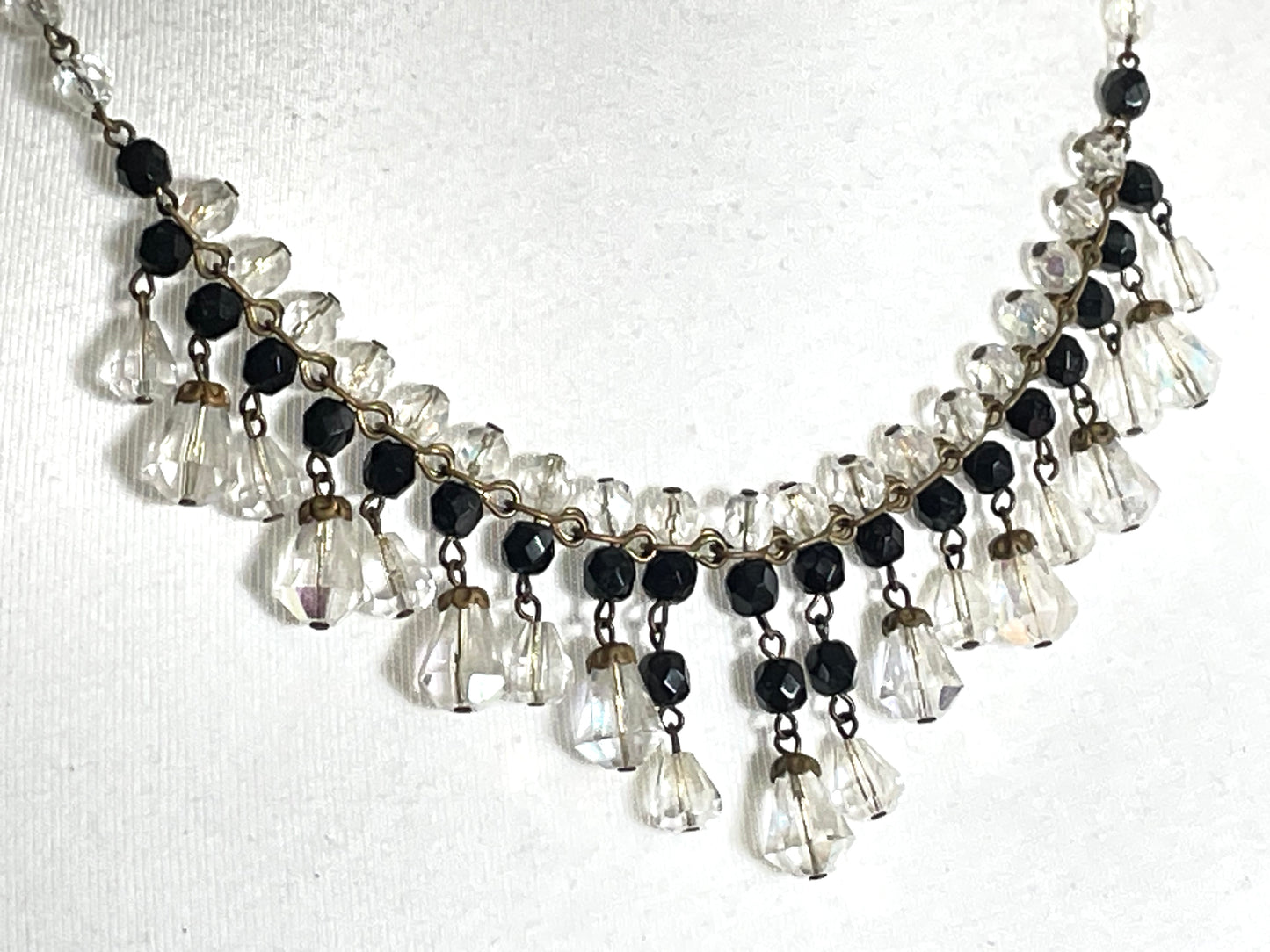 Vintage black and clear aurora borealis crystal faceted cut glass beaded fringe necklace with gold tone, delicate monochrome design