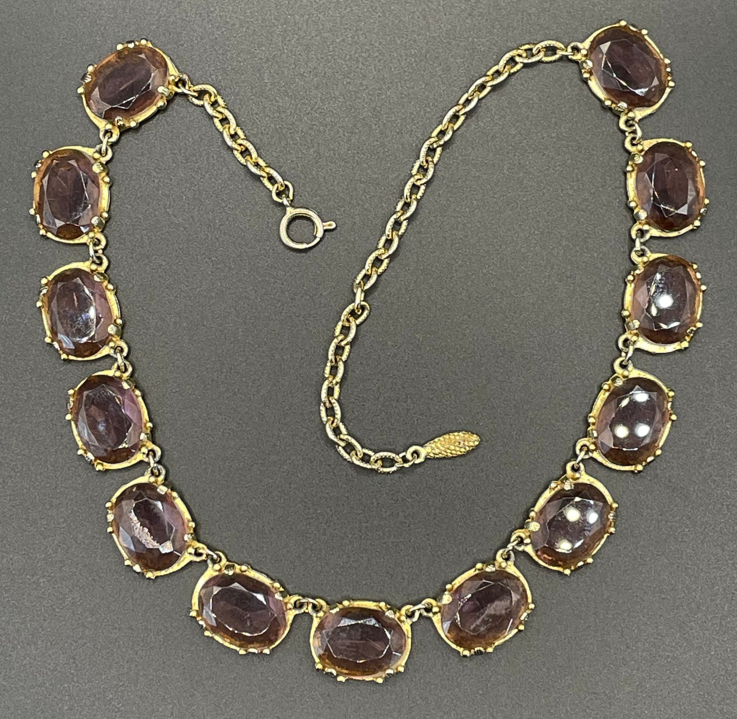 Vintage Sphinx amethyst purple / violet glass riviere necklace, heavy, bezel set, open-backed stones in ornate gold tone setting