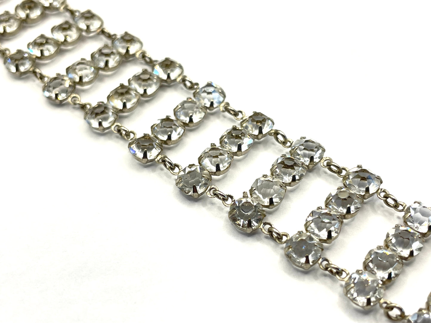 Vintage ice clear paste Art Deco tennis cocktail bracelet with rhinestone set open-backed in silver tone