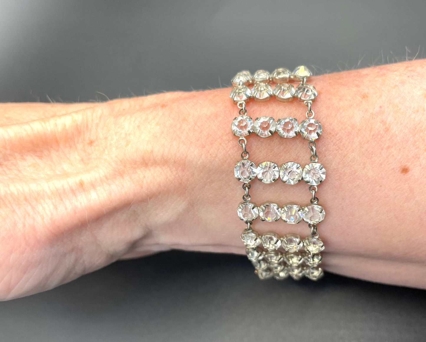 Vintage ice clear paste Art Deco tennis cocktail bracelet with rhinestone set open-backed in silver tone