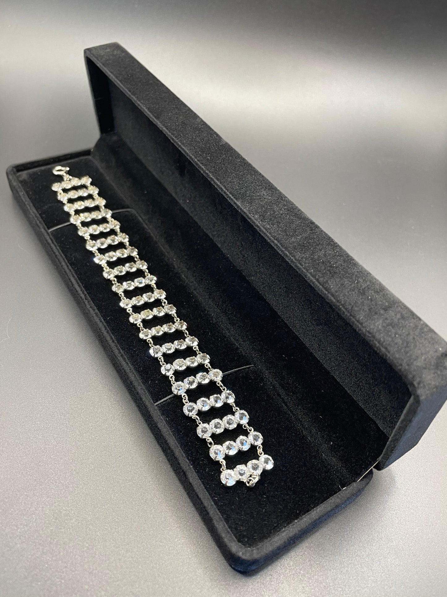 Vintage ice clear paste Art Deco tennis cocktail bracelet with rhinestone set open-backed in silver tone