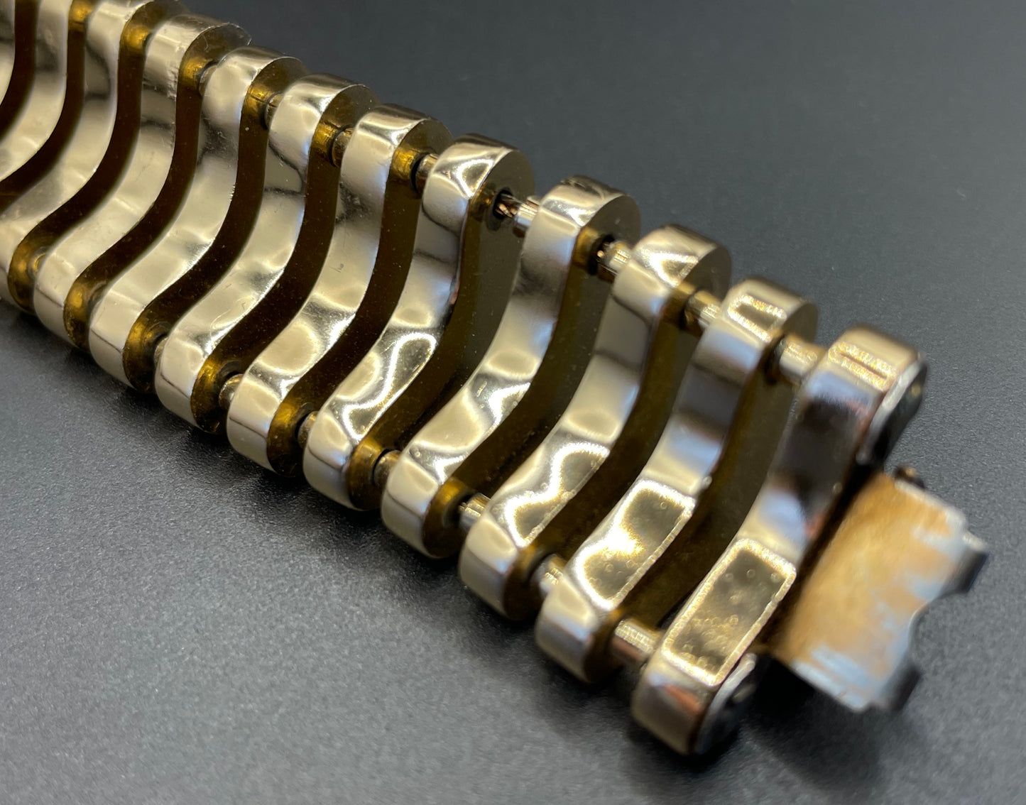 Vintage Art Deco machine age geometric architectural gold tone cuff bracelet, articulated tank track design