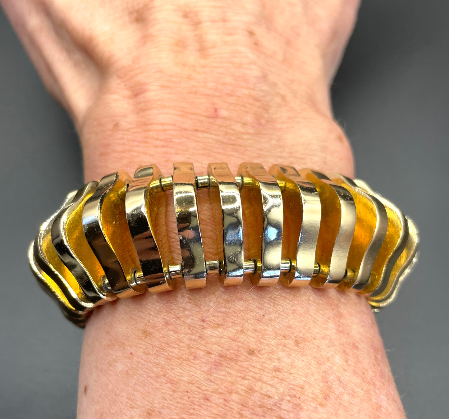 Vintage Art Deco machine age geometric architectural gold tone cuff bracelet, articulated tank track design