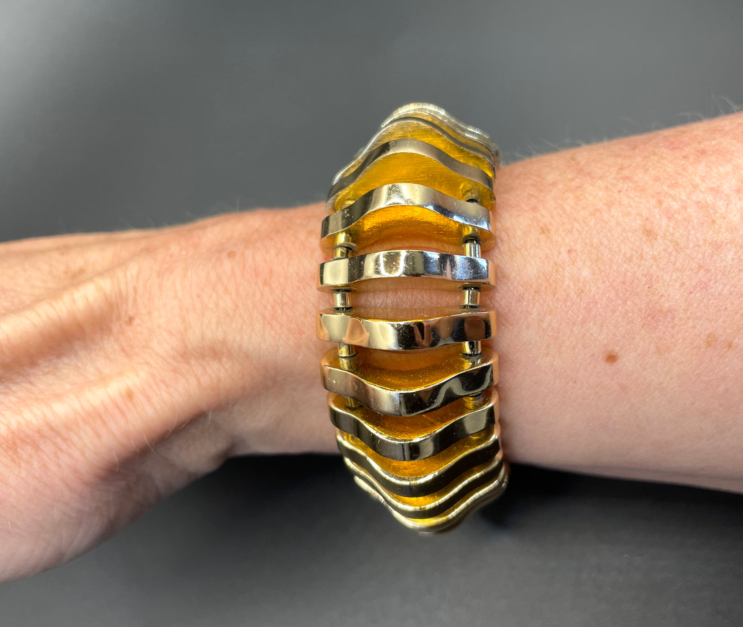Vintage Art Deco machine age geometric architectural gold tone cuff bracelet, articulated tank track design