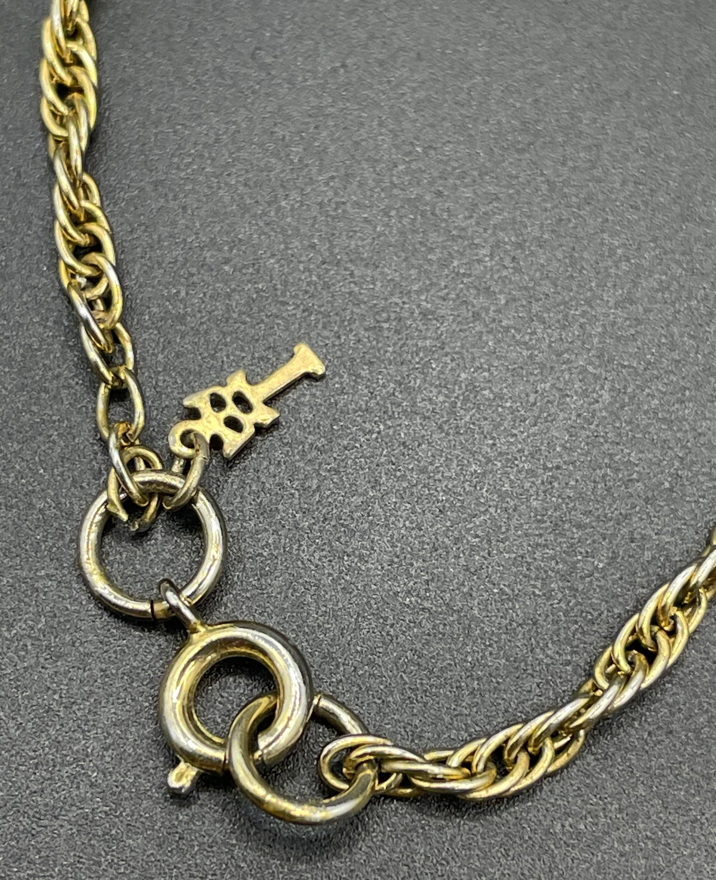 Vintage Trifari signed 1970s gold tone and black plastic / lucite bead disco chandelier pendant necklace and rope chain