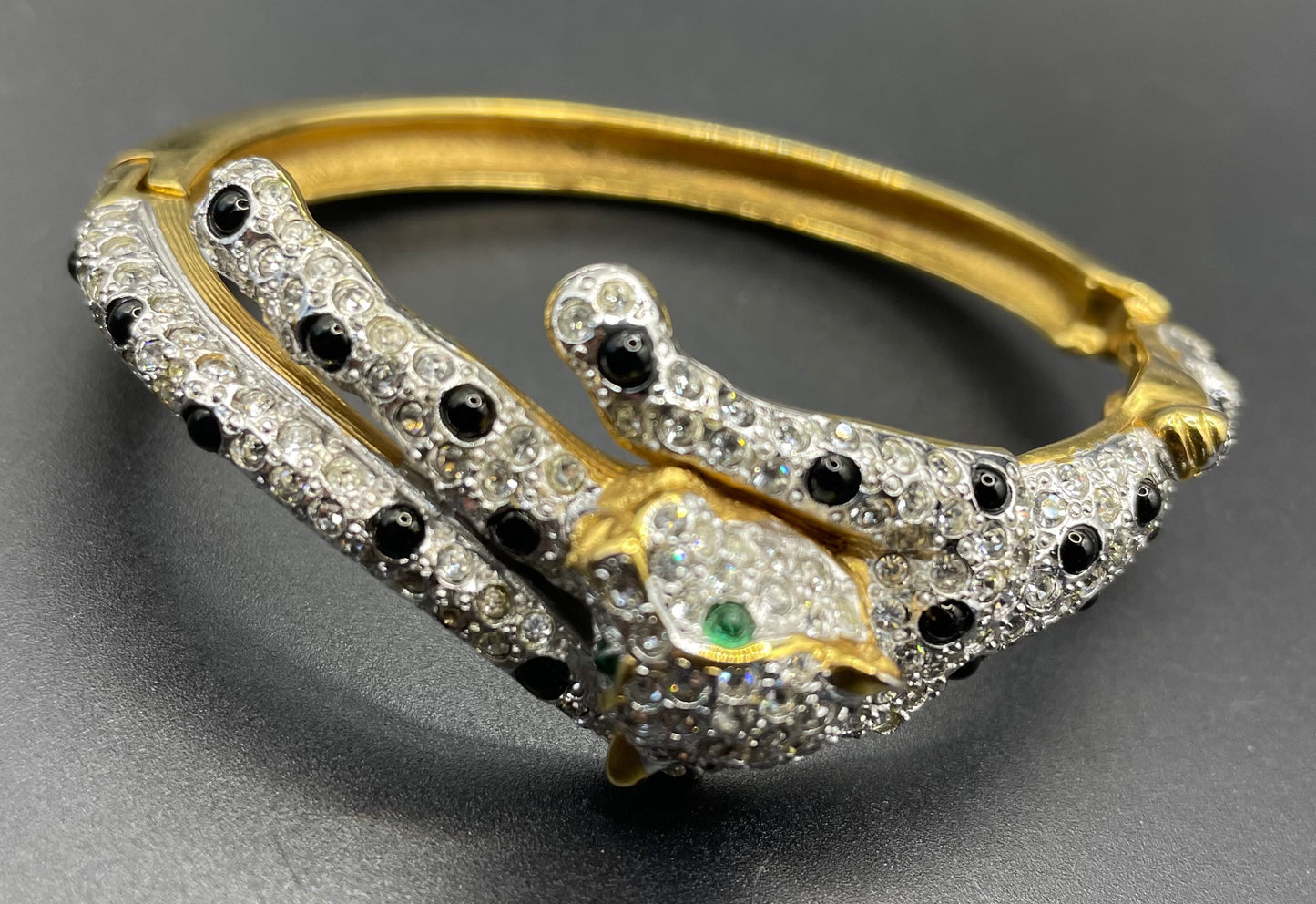 Vintage leopard / panther bangle, gold plated, green and black glass cabochons, clear rhinestones, interesting stamp signature