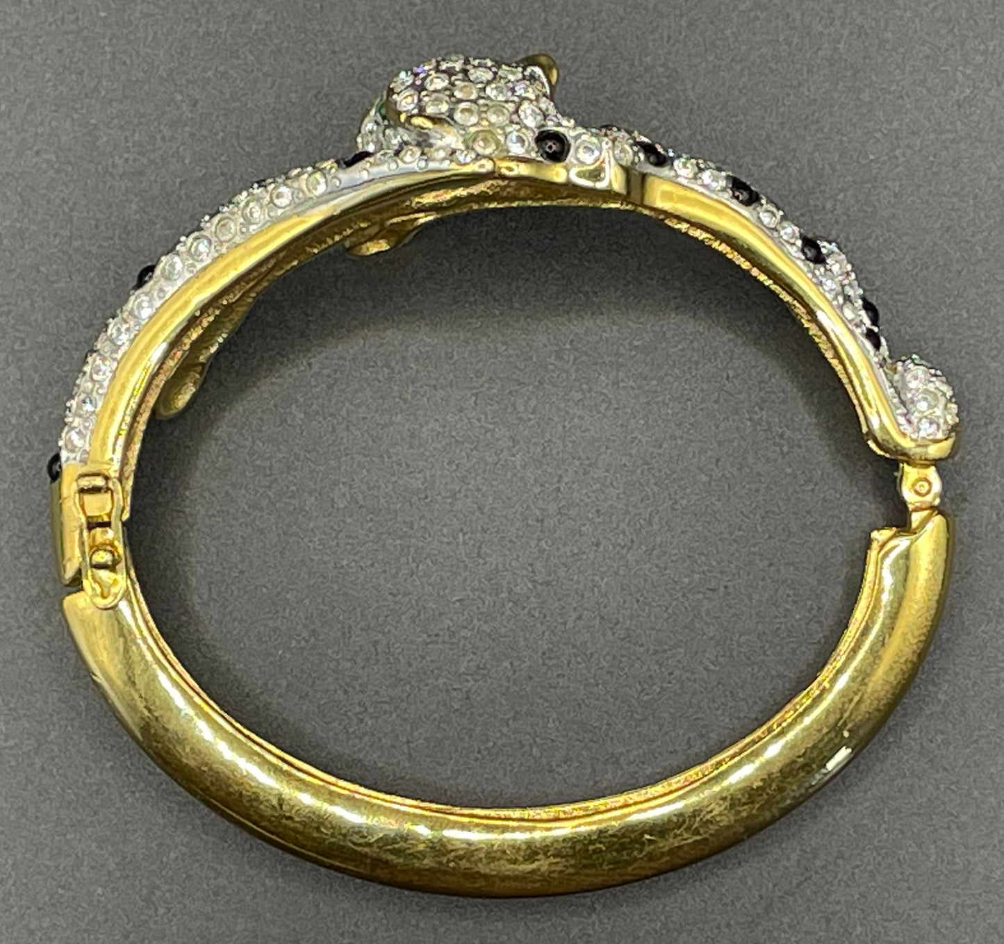 Vintage leopard / panther bangle, gold plated, green and black glass cabochons, clear rhinestones, interesting stamp signature