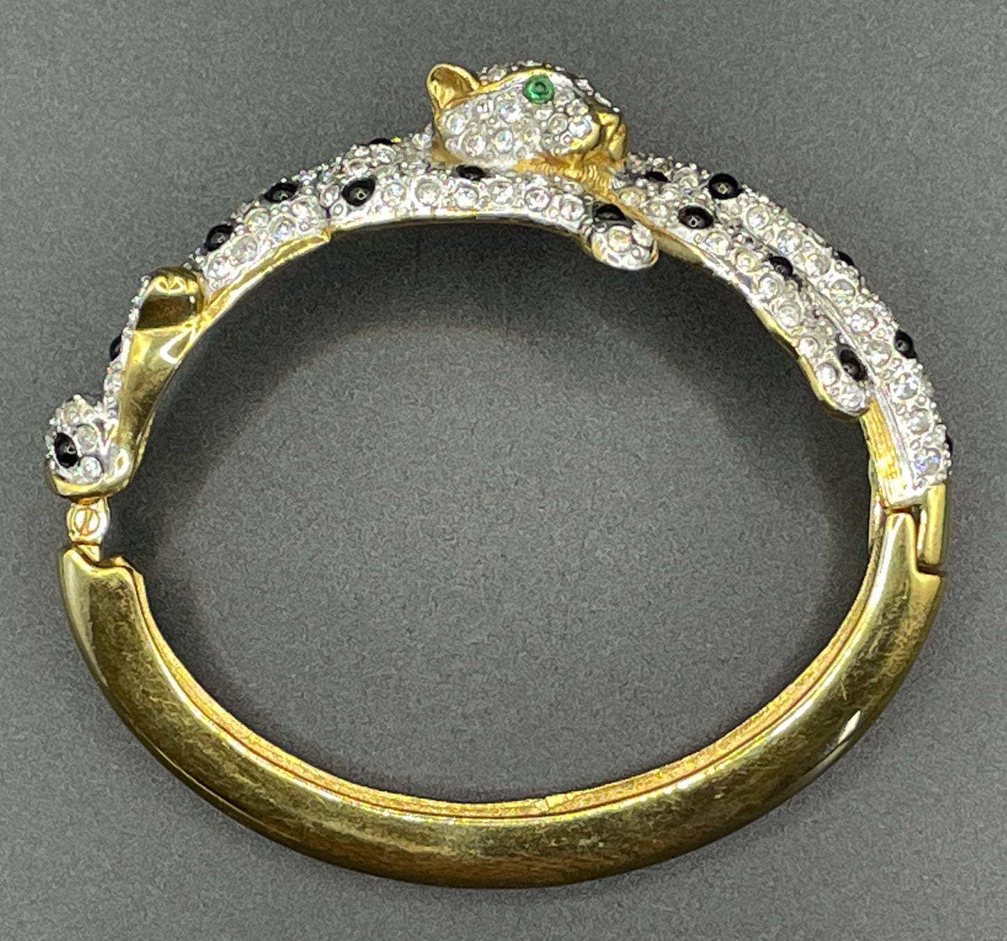 Vintage leopard / panther bangle, gold plated, green and black glass cabochons, clear rhinestones, interesting stamp signature